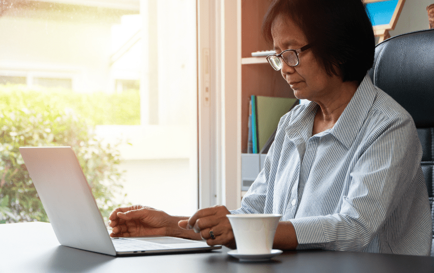 Middle-aged woman using the laptop