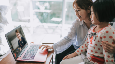 Mother and daughter doing a teleconsultation with a doctor