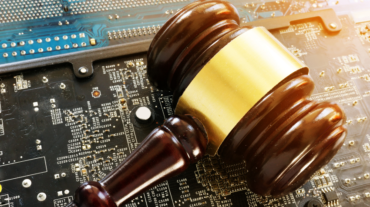 Gavel on top of a circuit board